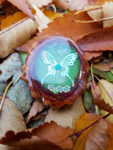 Butterfly liquid shaker pinecone pendant