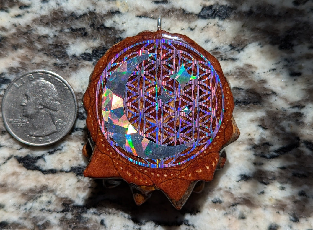 Crescent moon over flower of life