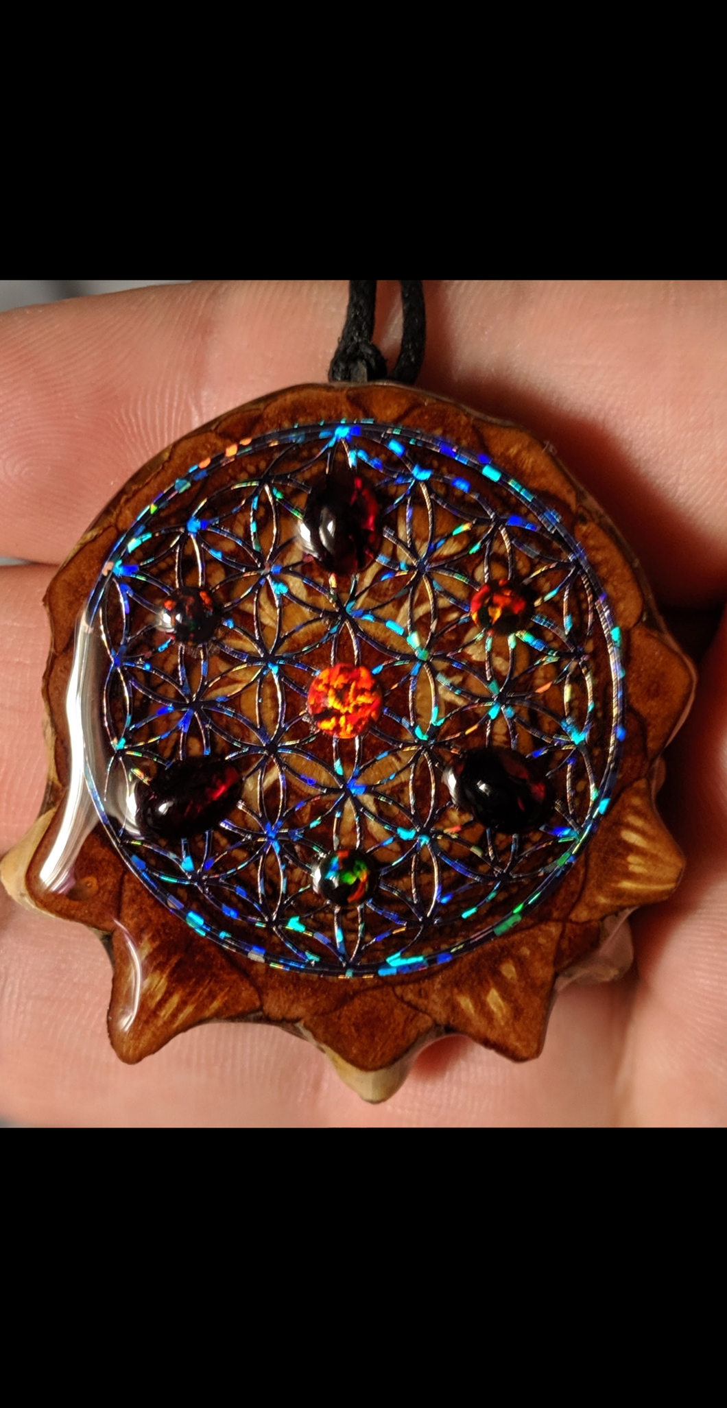 4 black opals with 3 garnet's over blackout flower of life
